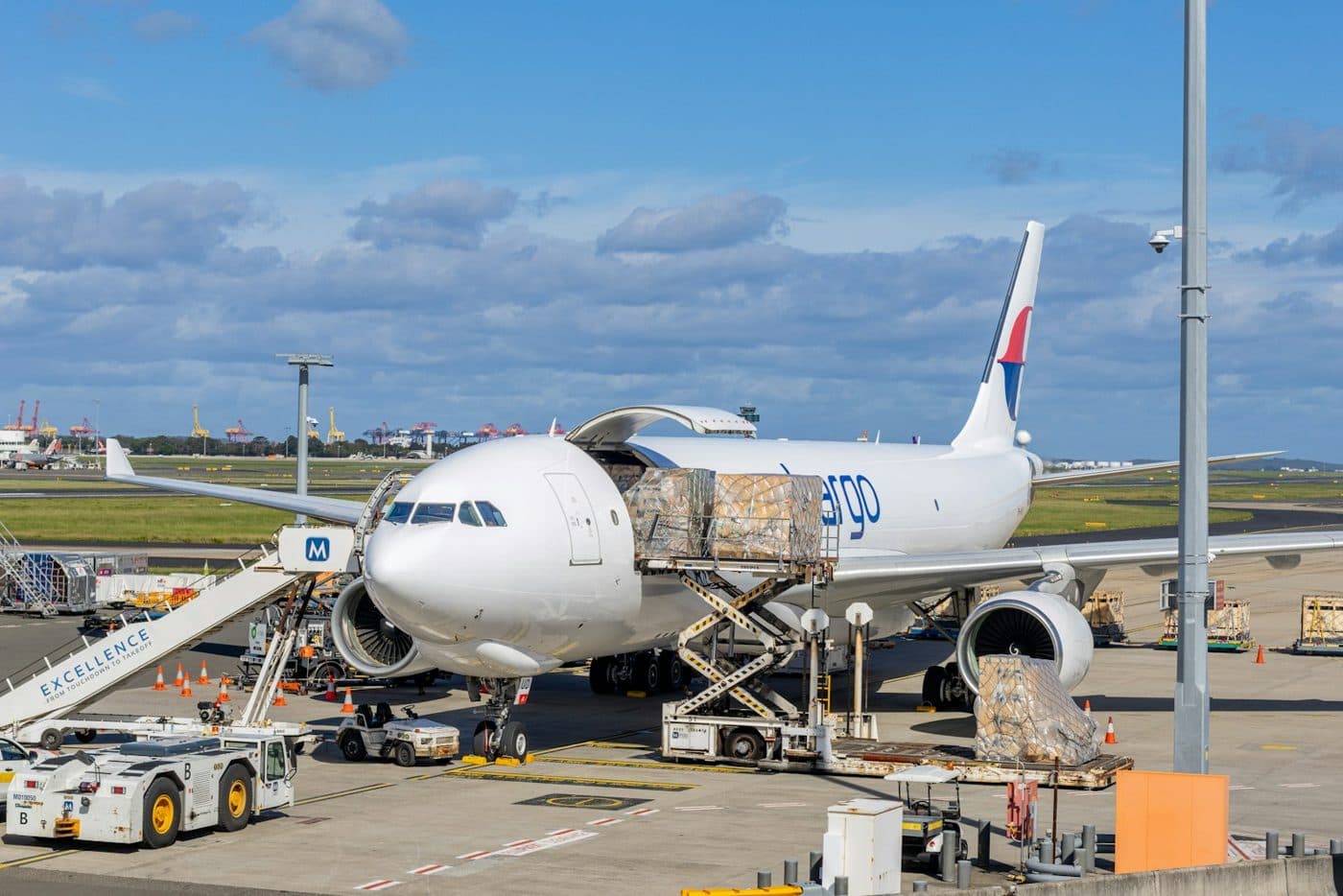 Cargo aircraft being loaded with freight